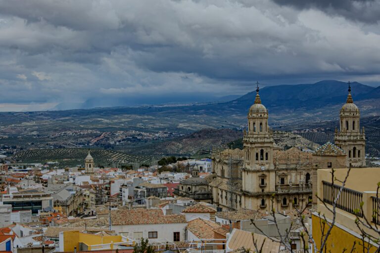 Dramatic landscape view of Jaén Cathedral and surrounding mountains in Andalusia.