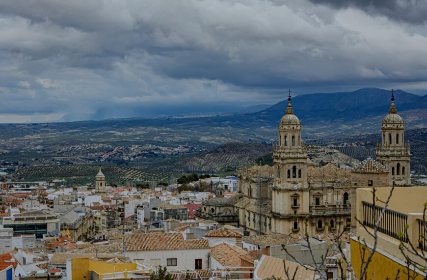 Dramatic landscape view of Jaén Cathedral and surrounding mountains in Andalusia.